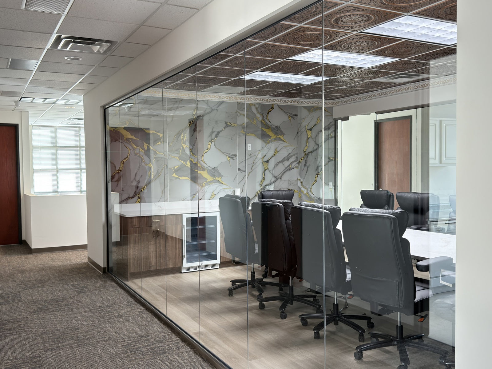 Modern office conference room with glass walls and a meeting table no privacy before window film