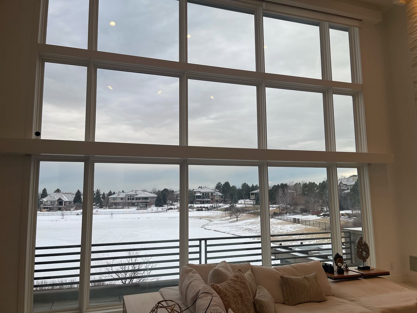 Living room with large windows showing a great veiw after window tint no shades or curtains needed 