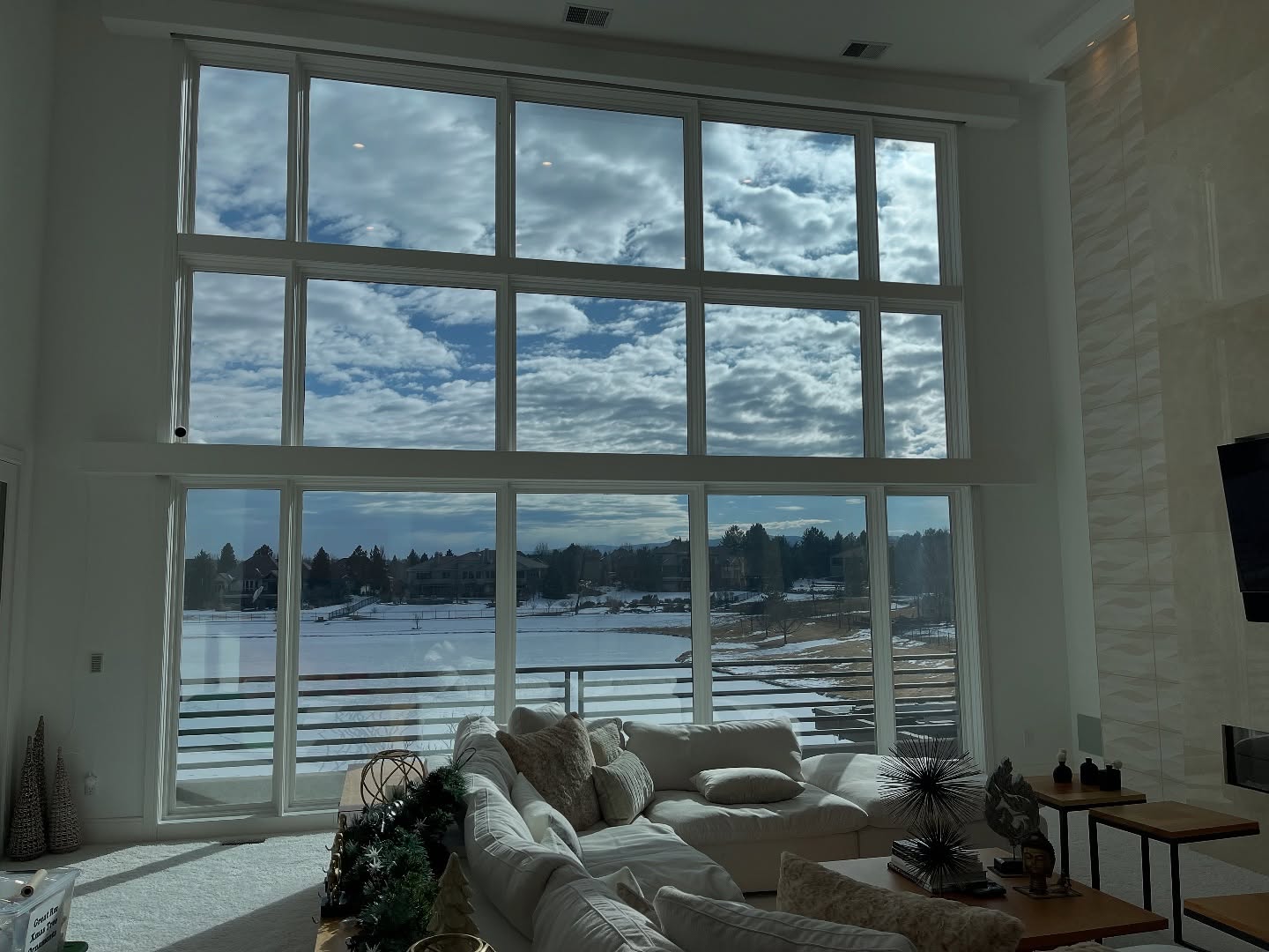 Living room with large windows showing great view after window tint no shades or curtains needed 