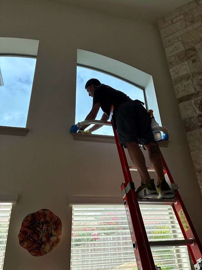 Window film installation on a high window 