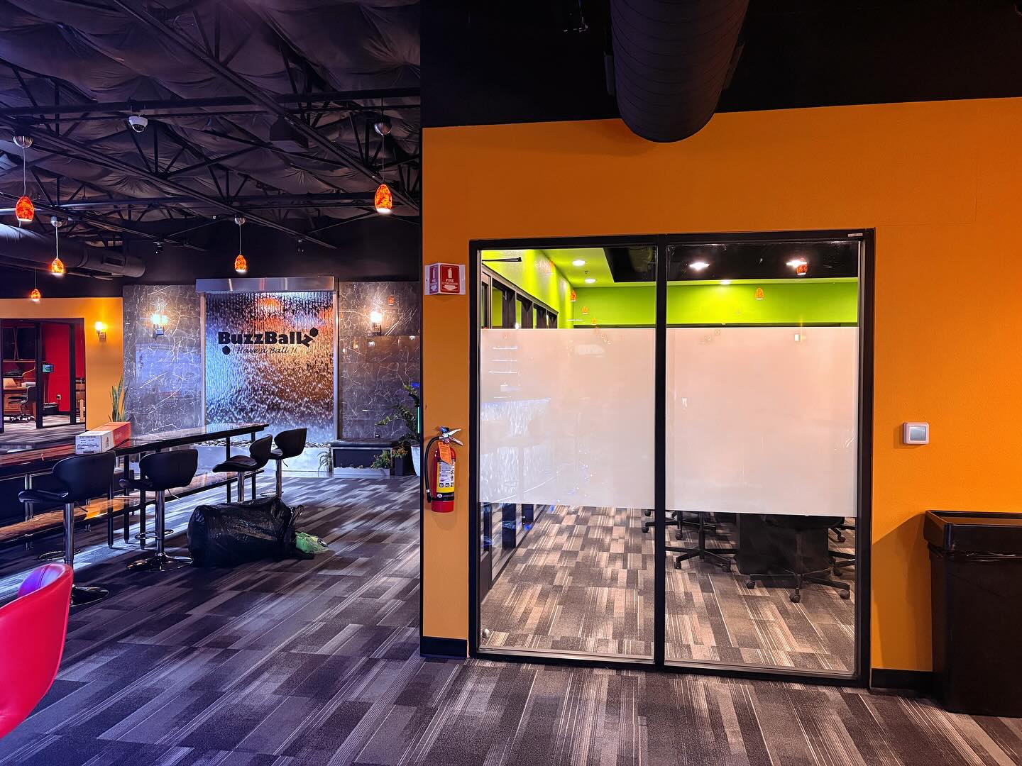 Modern office interior with colorful walls and glass doors, conference room privacy with window film